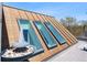 Unique sloped roof with skylights complemented by an interesting water feature on the deck at 501 S Race St, Denver, CO 80209