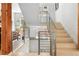Bright and modern staircase with light wood steps, metal railing, and ample natural light at 501 S Race St, Denver, CO 80209