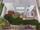 Aerial view of backyard with a deck, patio furniture, and a well-maintained lawn at 17806 Coral Burst St, Parker, CO 80134