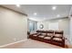Basement media room featuring three leather reclining chairs, pot lights, and carpet flooring at 17806 Coral Burst St, Parker, CO 80134