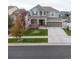 Charming two-story home with a well-manicured lawn and attached two car garage at 17806 Coral Burst St, Parker, CO 80134