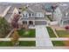 Beautiful two-story home with a manicured front lawn and attached two-car garage at 17806 Coral Burst St, Parker, CO 80134