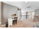 Loft area featuring a desk setup, carpet flooring, and a view of the staircase with a dark metal railing at 17806 Coral Burst St, Parker, CO 80134