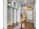 Functional mudroom featuring built-in storage, bench seating, and coat hooks at 17806 Coral Burst St, Parker, CO 80134