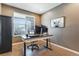Functional home office with large window, sleek furniture, and modern decor at 17806 Coral Burst St, Parker, CO 80134