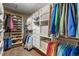 Spacious walk-in closet with custom shelving and ample storage for clothing and shoes at 17806 Coral Burst St, Parker, CO 80134