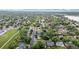 Lush green neighborhood aerial view showcases the homes nestled amongst mature trees in a serene community at 7912 Fenton St, Arvada, CO 80003