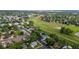 Aerial view of a neighborhood next to park with walking path, showcasing a blend of community and green spaces at 7912 Fenton St, Arvada, CO 80003