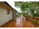 Outdoor deck with wood railing, fire pit, and space for outdoor seating. Perfect for entertaining at 7912 Fenton St, Arvada, CO 80003