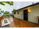 Back deck featuring an outdoor fireplace with seating and offering ample space for entertaining at 7912 Fenton St, Arvada, CO 80003
