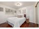 Relaxing bedroom boasts hardwood floors, comfy bed, large window, and stylish bedside table at 7912 Fenton St, Arvada, CO 80003