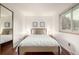 Bright bedroom with a cozy bed, neutral decor, and plenty of natural light at 7912 Fenton St, Arvada, CO 80003