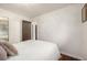 This bright bedroom includes hardwood floors, a closet, and a comfortable queen-sized bed at 7912 Fenton St, Arvada, CO 80003