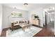 Inviting living room featuring a modern sofa, contemporary furniture, and ample natural light at 7912 Fenton St, Arvada, CO 80003