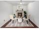 Cozy living room featuring a stone fireplace, elegant chairs, and a stylish rug at 7912 Fenton St, Arvada, CO 80003