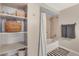 Bright bathroom with shower-tub combination and organized storage at 1150 Vine St # 201, Denver, CO 80206