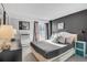 Stylish bedroom featuring a comfortable bed, elegant decor, and ample natural light at 1150 Vine St # 201, Denver, CO 80206