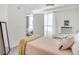 Bright bedroom features a cozy bed, soft natural light, and modern decor at 1150 Vine St # 201, Denver, CO 80206