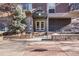 Inviting building entrance features an awning and well-maintained landscaping, enhancing curb appeal at 1150 Vine St # 201, Denver, CO 80206