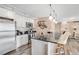 Modern kitchen with stainless steel appliances, sleek countertops, and bar seating at 1150 Vine St # 201, Denver, CO 80206