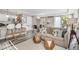 Bright living room featuring modern decor, including a comfortable sofa and stylish accent tables at 1150 Vine St # 201, Denver, CO 80206