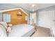 Bedroom with gray-blue walls, carpet, white trim, a creative design feature, and built-in storage at 2753 E 139Th Dr, Thornton, CO 80602