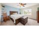 Bedroom features a rocking chair, vintage trunk, and light blue accent wall at 2753 E 139Th Dr, Thornton, CO 80602