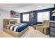 Inviting bedroom with an eye-catching accent wall, comfortable furniture, and natural light at 2753 E 139Th Dr, Thornton, CO 80602