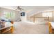 Spacious bonus room with a large window, comfortable seating, and plenty of room to play or study at 2753 E 139Th Dr, Thornton, CO 80602