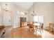 Dining room with hardwood floors, vaulted ceilings, a modern chandelier, and a large hutch at 2753 E 139Th Dr, Thornton, CO 80602