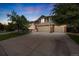 Charming two-story home with a well-maintained lawn, mature trees, and a spacious three-car garage at 2753 E 139Th Dr, Thornton, CO 80602