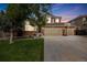 Charming two-story home boasting a well-manicured lawn, brick accents, and a spacious three-car garage at 2753 E 139Th Dr, Thornton, CO 80602