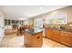 Open kitchen features an island, granite countertops, stainless appliances and breakfast nook at 2753 E 139Th Dr, Thornton, CO 80602