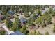 Aerial view of the home surrounded by mature trees and lush landscaping in a desirable neighborhood at 5414 Golden Currant Way, Parker, CO 80134