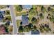 Aerial view of a home with a grey roof surrounded by lush green trees and backyard trampoline at 5414 Golden Currant Way, Parker, CO 80134