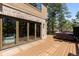 Outdoor living on a deck with a hot tub, and lush trees at 5414 Golden Currant Way, Parker, CO 80134