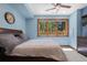 Comfortable bedroom with a large window, ceiling fan, and wood accents at 5414 Golden Currant Way, Parker, CO 80134