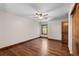 Bedroom showcasing hardwood floors, natural light, and ceiling fan at 5414 Golden Currant Way, Parker, CO 80134