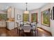 Cozy breakfast nook with natural light, hardwood floors and backyard view at 5414 Golden Currant Way, Parker, CO 80134