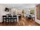 Spacious kitchen boasts custom cabinetry, granite countertops, stainless steel appliances, and a dining area at 5414 Golden Currant Way, Parker, CO 80134