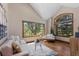Relaxing living room with vaulted ceilings, natural light, hardwood floors, and comfortable seating at 5414 Golden Currant Way, Parker, CO 80134