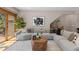Comfortable living room featuring hardwood floors, plush seating, with access to an outdoor patio at 5414 Golden Currant Way, Parker, CO 80134