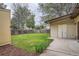 A well-maintained backyard with grass, a wooden fence and a storage shed at 7618 Umatilla St, Denver, CO 80221