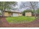 Lush backyard with green grass and a storage shed at 7618 Umatilla St, Denver, CO 80221