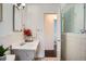 Bathroom featuring a vanity sink and tiled walls at 7618 Umatilla St, Denver, CO 80221