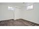 Cozy bedroom with neutral carpet and closet at 7618 Umatilla St, Denver, CO 80221