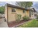 Charming brick home with a well-manicured garden and a cozy, inviting entrance, perfect for curb appeal at 7618 Umatilla St, Denver, CO 80221