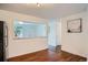 Spacious living room with hardwood floors and a clear view into other rooms for an open and airy feel at 7618 Umatilla St, Denver, CO 80221