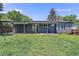 Backyard featuring a covered patio and lush greenery at 2260 S Lewiston St, Aurora, CO 80013
