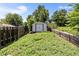 View of the property's backyard featuring the shed and wooden fence at 2260 S Lewiston St, Aurora, CO 80013